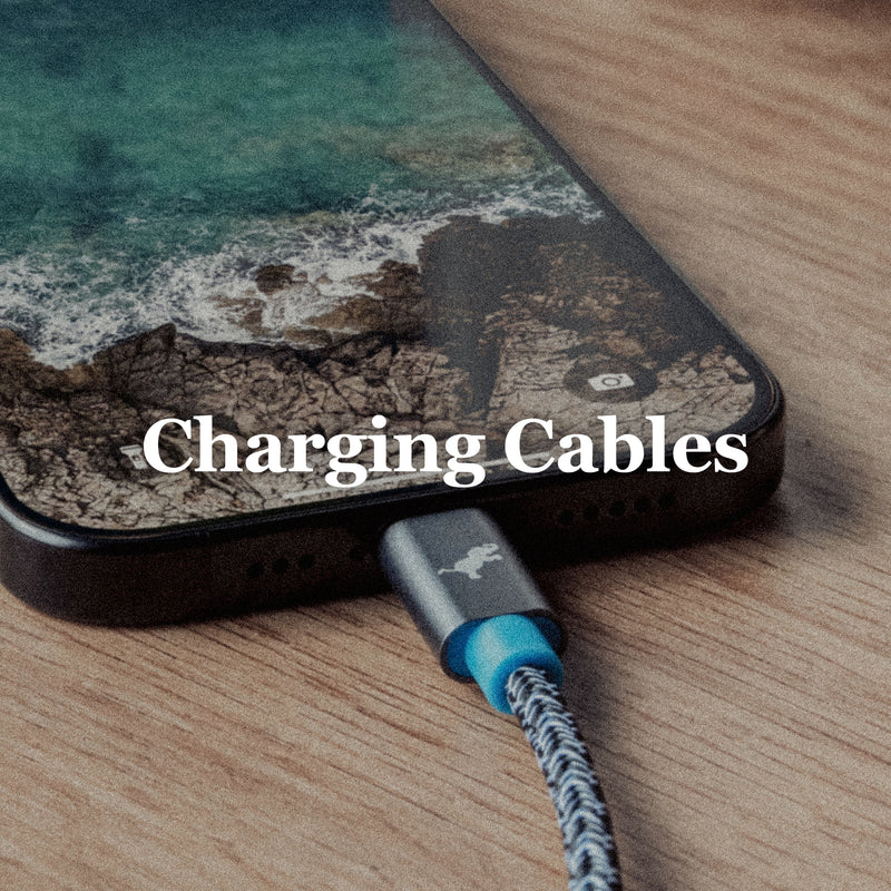 Image of iPhone connected to black and white powerknit cable with blue and gray cable head on wood surface. Charging Cables text overlay.